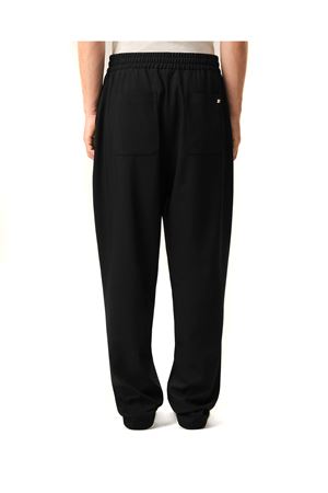 Pantaloni in gabardine di lana nera AMI | HTR868WV0194001